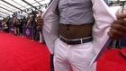 Ezekiel Elliott brings the cut off shirt to the red carpet