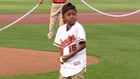 Bilateral hand transplant patient throws out first pitch