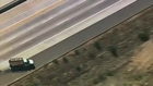 Wanted bank robber flies off freeway during police chase