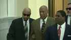 Cosby appears in court, lawyers urge case dismissal