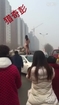 Naked woman jumps on hood to demand justice