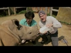 Animal Jam - Dr. Brady Barr and a baby white rhinoceros