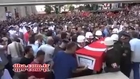 Turkish Minster running and chased by dead soldiers family and turkish people in dead turkish soldier funeral