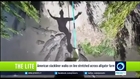 American slackliner walks on line stretched across alligator farm