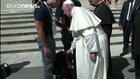 Pope shakes paw of rescue dog