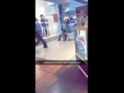 Woman stops a man running from mall security.